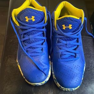 Blue yellow and white boys under armour shoes